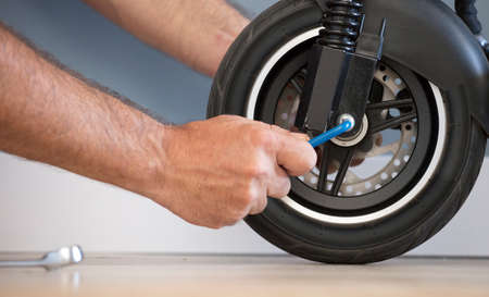 Electric motorcycle maintenance service concept. Repair service. Technological concept.の写真素材