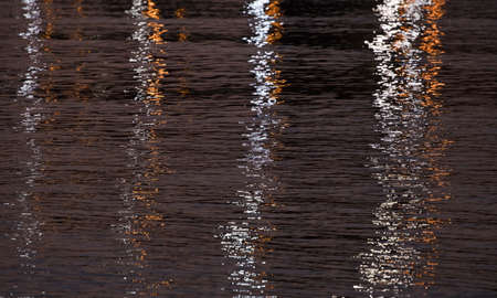 lights reflected on the sea. in the nightの写真素材