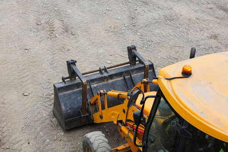 detail of excavator machine, on landの写真素材