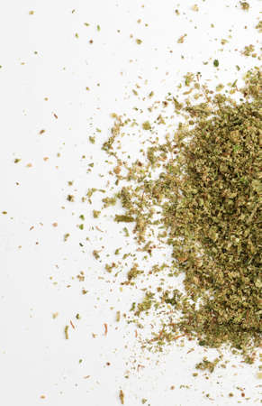 partial view of crushed marijuana, white background, space for textの写真素材