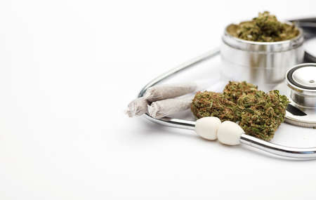 marijuana buds, joint, grinder, phonendoscope, with white background, space for text.の写真素材