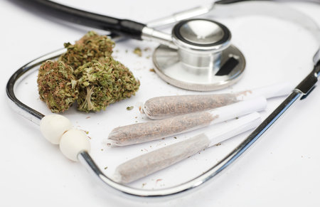marijuana buds, joint, phonendoscope, with white background, space for text.の写真素材