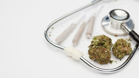 marijuana buds, joint, phonendoscope, with white background, space for text.の写真素材