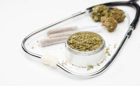 grinder with marijuana buds, joint, phonendoscope, with white background.の写真素材