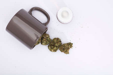 gray cup for infusion with marijuana, on a white backgroundの写真素材