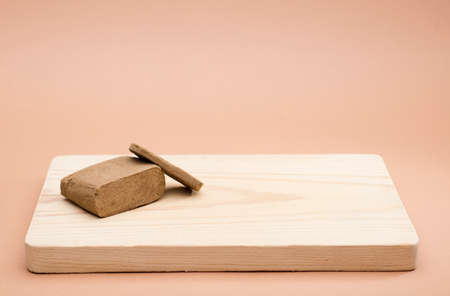 hashish large portion on wood with space for text, brown backgroundの写真素材