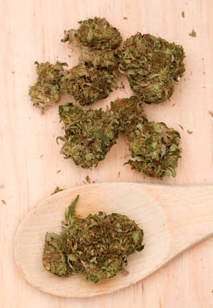 batch of buds on wood, with spoonの写真素材