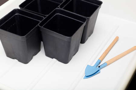 pots for planting, with cultivation tools, with a white backgroundの写真素材