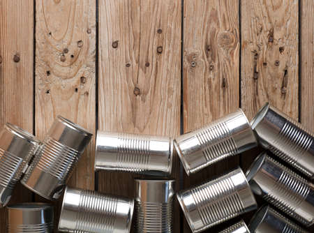 recycled cans, reused on a table with a brown background top view, space for text.の写真素材