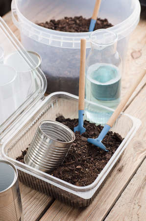 recycled pots for garden, gardening tools on work tableの写真素材