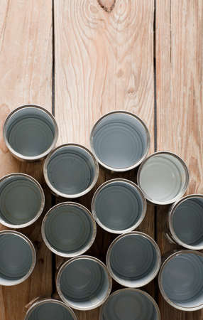 recycled cans, reused on a table with a brown background top view, space for text.の写真素材
