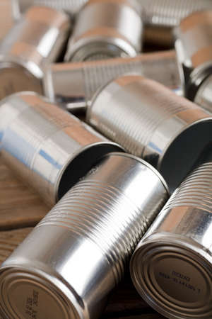 recycling of cans for home on rustic wooden table. second life to aluminum cansの写真素材