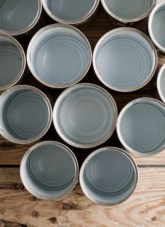 recycled aluminum cans, on old rustic woodの写真素材