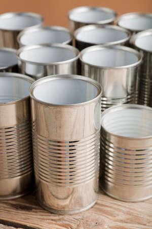 recycling of cans for home on rustic wooden table, brown badground, second life to aluminum cansの写真素材