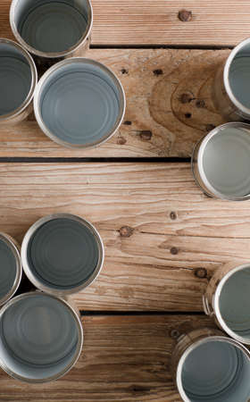 recycled aluminum cans, on old rustic woodの写真素材