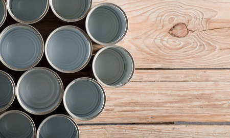 recycled cans, reused on a table with a brown background top view, space for text.の写真素材