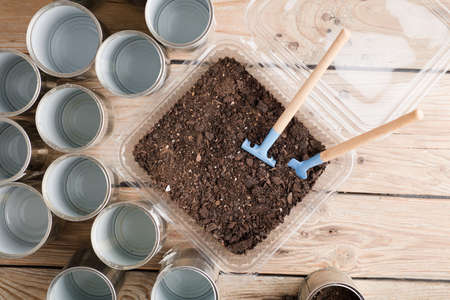recycled pots for garden, gardening tools on work tableの写真素材
