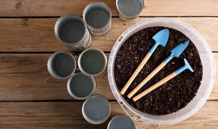 recycled pots for garden, gardening tools on work tableの写真素材