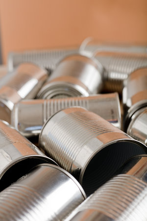 recycling of cans for home on rustic wooden table. second life to aluminum cansの写真素材