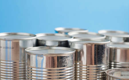 recycling of cans for home blue background. second life to aluminum can, blue background.