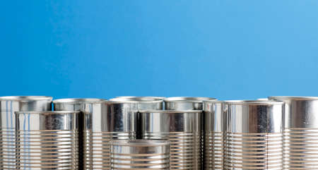 recycling of cans for home blue background. second life to aluminum can, blue background.の写真素材