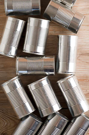 recycling of cans for home on rustic wooden table. second life to aluminum cans