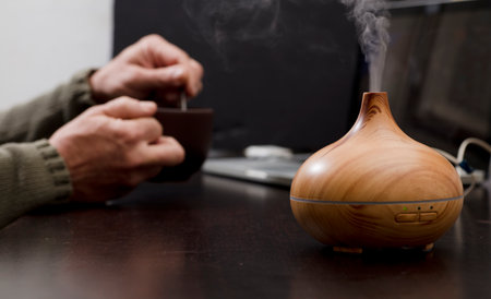 wood fragrance on desk table with steam essence of natural oils