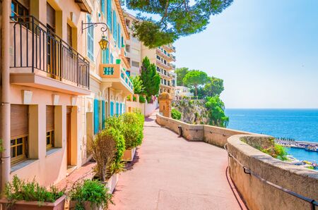 Monaco, Monte Carlo. Monaco village with colorful architecture and street along the ocean.の写真素材
