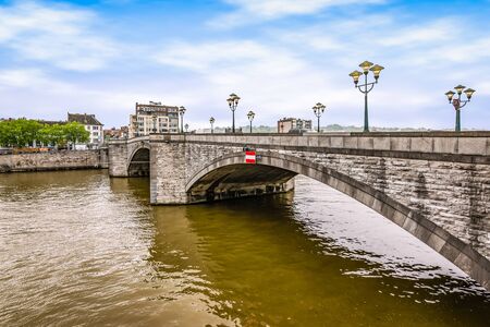 Bridge over the river Meuse in Huy, Ardennes, Belgium.の写真素材