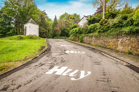 Mur de Huy, Wallonia, Belgium. White chapel along an asphalt hill road. Part of the route of The Wallonia Arrow professional cycle road race.の写真素材