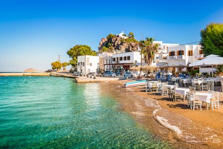 Patmos Island, Greece. Skala village and harbor view with beach at the port.の写真素材