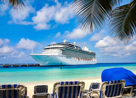 Cruise Ship docked at the beach on tropical Island.の写真素材