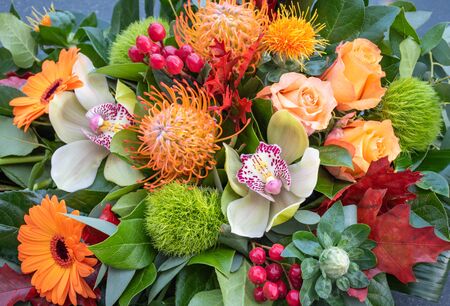 Orange bouquet with mixed flowers.の写真素材