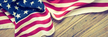 USA flag on wood. Background banner for American celebrations and holidays.の写真素材