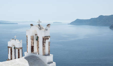Greek Orthodox church near the sea. Oia and Santorini travel concept.の写真素材