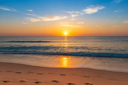 Stunning sunrise and beach landscape.の写真素材