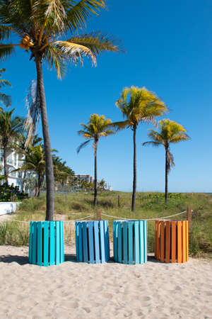 Colorful trash cans on the beach.の写真素材