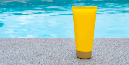 Tube of sunscreen at the swimming pool. Mock-up.の写真素材