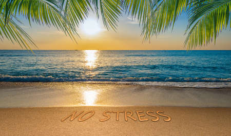 No stress concept with tropical beach and written text in the sand.の写真素材