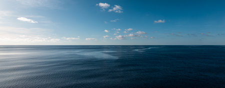 Panoramic sea view with calm sea and blue sky. Tranquil seascape. Indian Ocean.