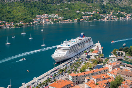 KOTOR, MONTENEGRO - SEPTEMBER 5, 2022: Cruise ship Hapag LLoyd MS Europa 2 docked in port of Kotor Montenegro. Aerial view.のeditorial素材