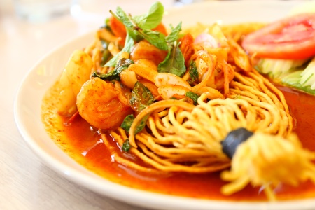 Tom Yam Koong and Squid soup with noodles  Thai cuisineの写真素材
