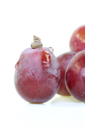 Red grape isolated on white.の写真素材