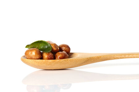 herb salted peanuts  on white backgroundの写真素材