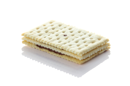Sandwich biscuits with chocolate on white backgroundの写真素材