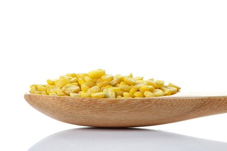Hulled-split monk beans on whiteの写真素材