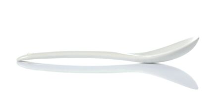 White plastic spoon isolated on whiteの写真素材