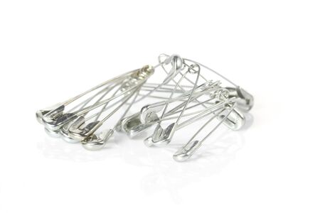 safety pins isolated on white backgroundの写真素材