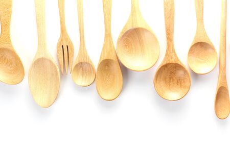 wooden spoon isolated over white.の写真素材
