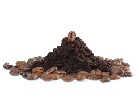 Coffee beans and ground coffee isolate on whiteの写真素材